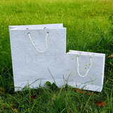 Plantable paper bags on grass