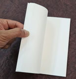 handmade paper notepad with seed embedded paper in white colour 