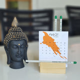 Plantable desktop calendar with white plantable pencils with stand and buddha statue