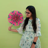 girl using hand fan made of pink colour handmade paper